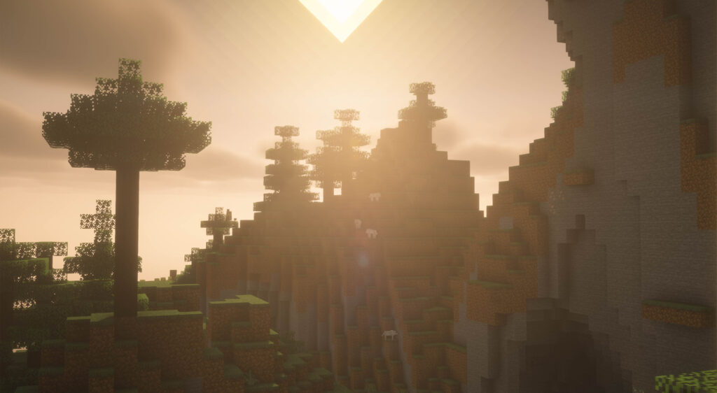 A Minecraft screenshot of a peaceful sunset over a mountain, with sheep grazing on the hillside.